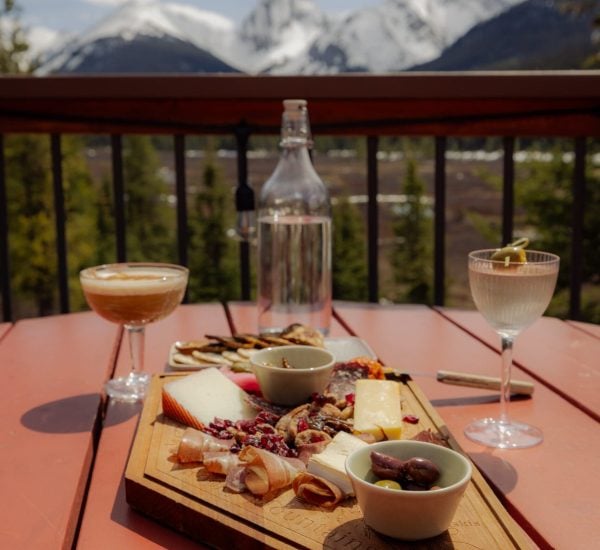 Mount Engadine Lodge mountain view restaurant patio with afternoon tea and cocktails